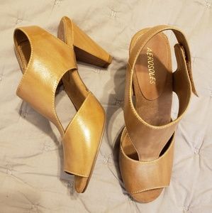 Nude colored T strap sandals,